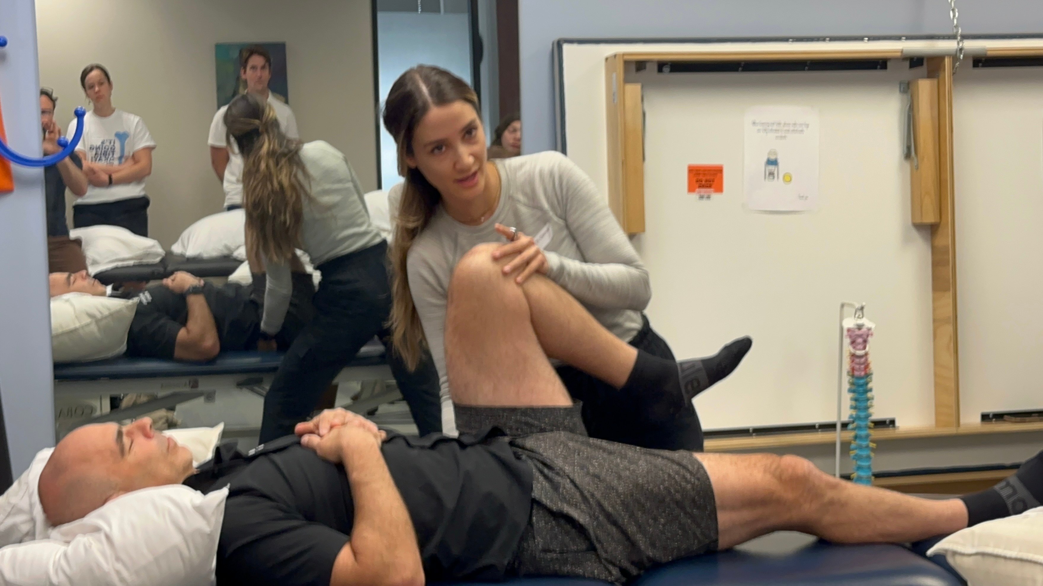 Physical therapist performing a gait assessment on a runner at a sports physical therapy clinic in Mountain View, CA